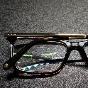 Versace men’s eyeglasses, Tortoise dark brown frames with gold temples and tips.
